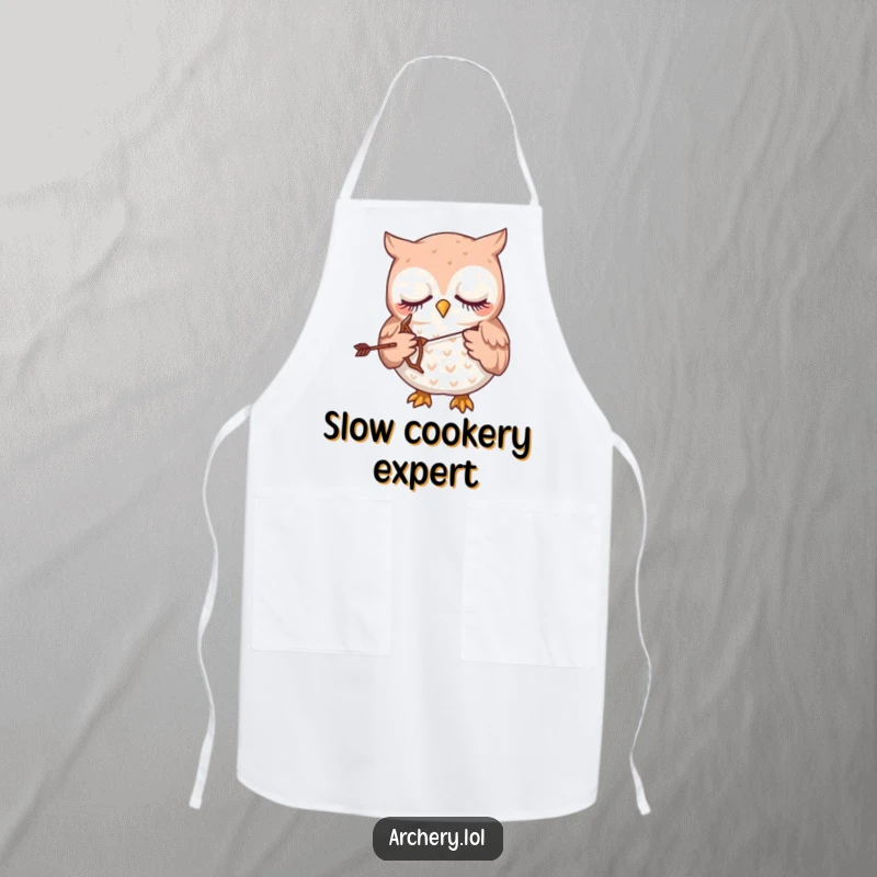 Funny apron showing a sleepy owl gently holding a tiny bow and arrow, wearing a chef's hat.