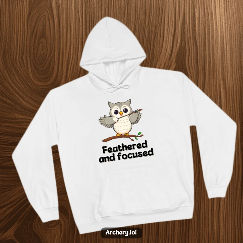 Funny Hoodie: A joyful owl perched, expertly aiming an arrow with remarkable accuracy, embodying focus and fun.