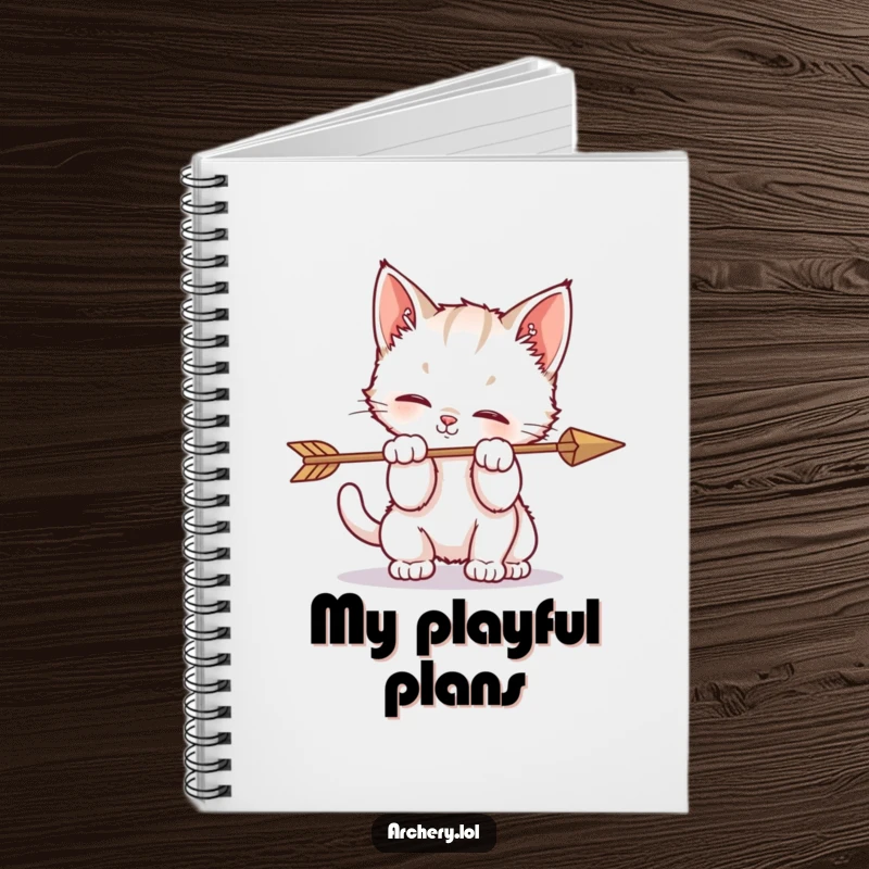 Funny notebook cover with a kitten playfully batting at an arrow, symbolizing adorable and humorous curiosity.